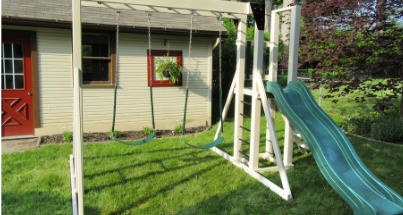 Monkey Bar Slide Stand vinyl-encased backyard playset.